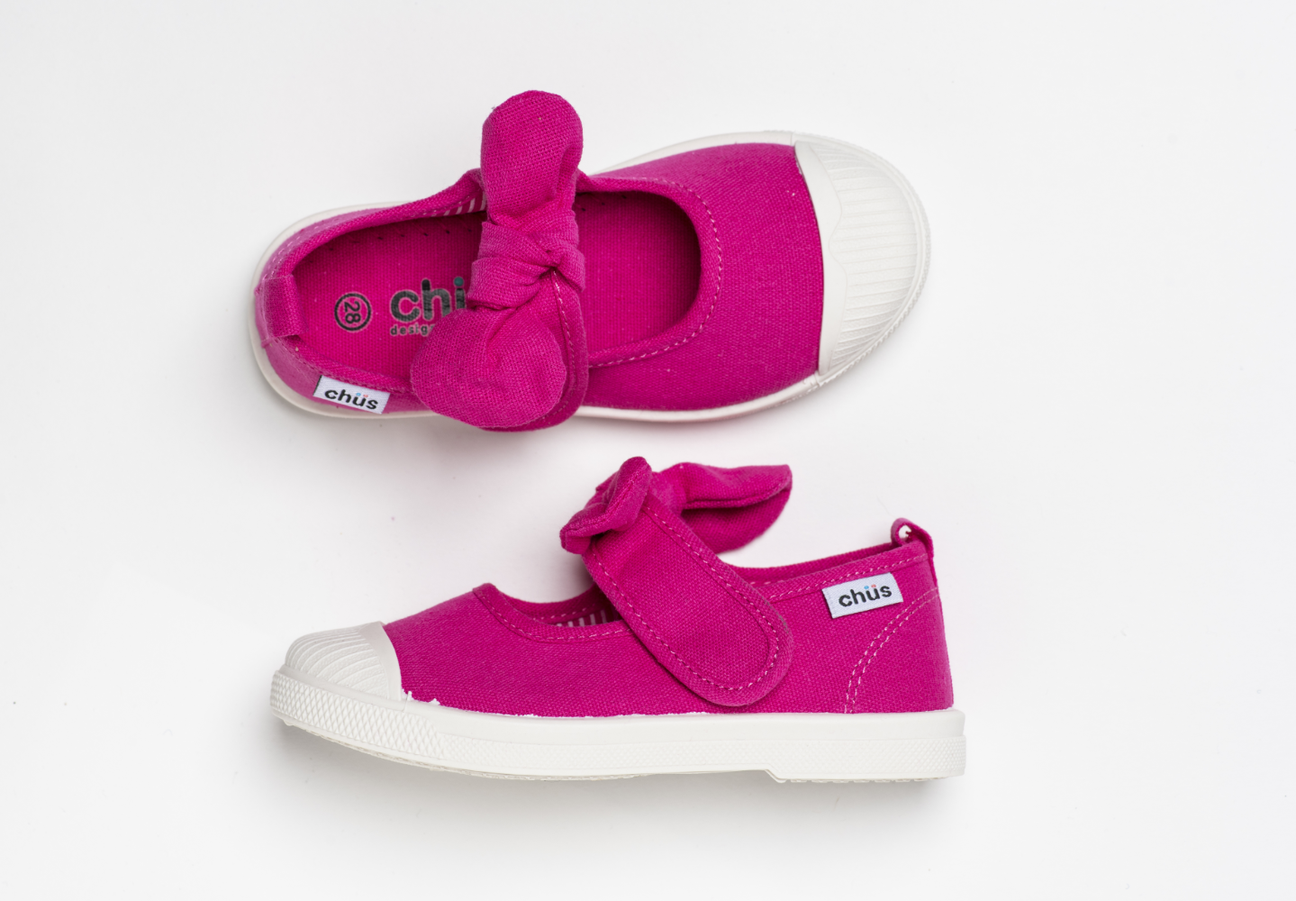 Canvas sneakers with single velcro strap and removable bow tie in fuchsia / hot pink. Adorable monogrammed. Chus Shoes. Top view.
