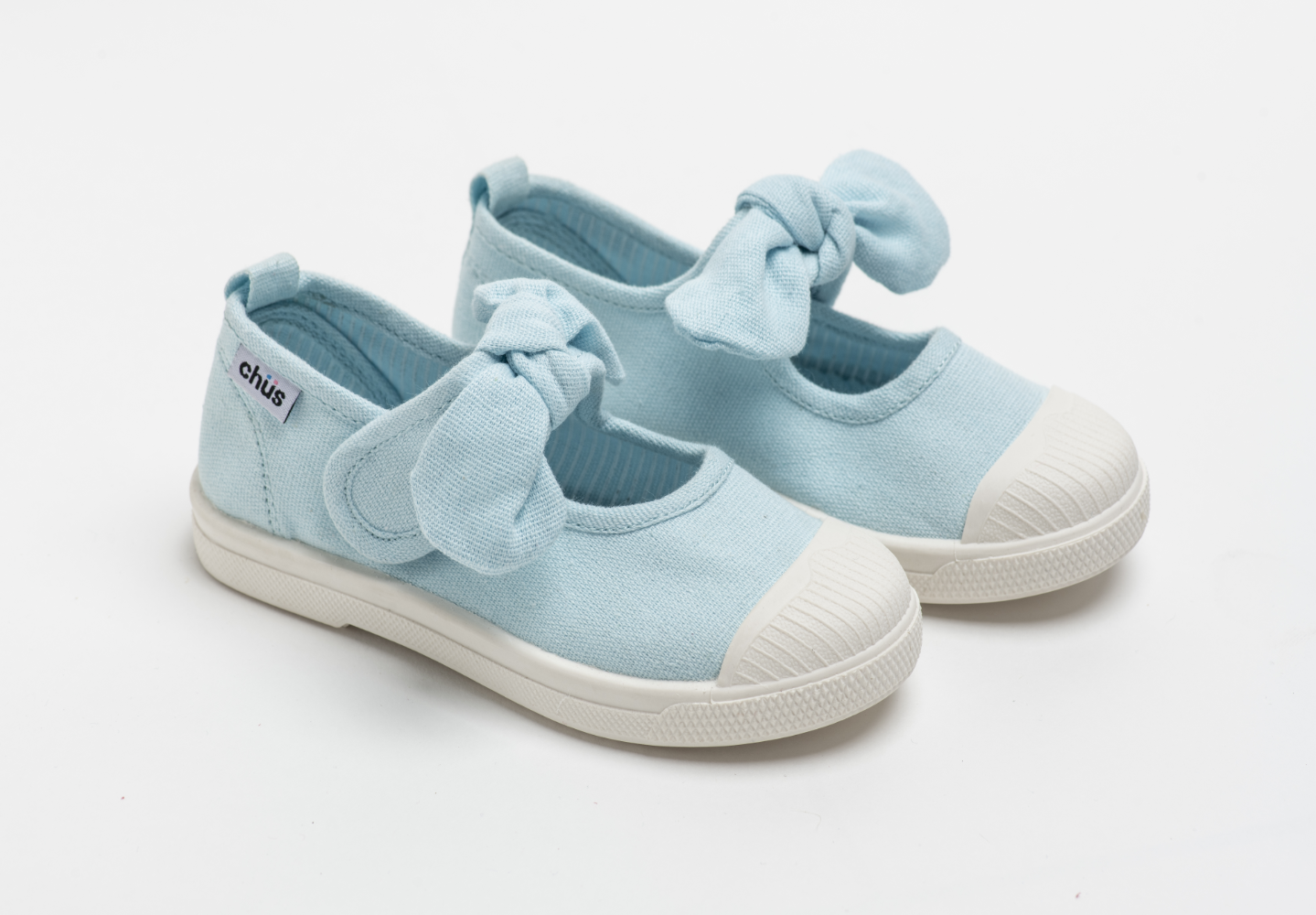 Canvas sneakers with single velcro strap and removable bow tie in light blue. Adorable monogrammed. Chus Shoes.