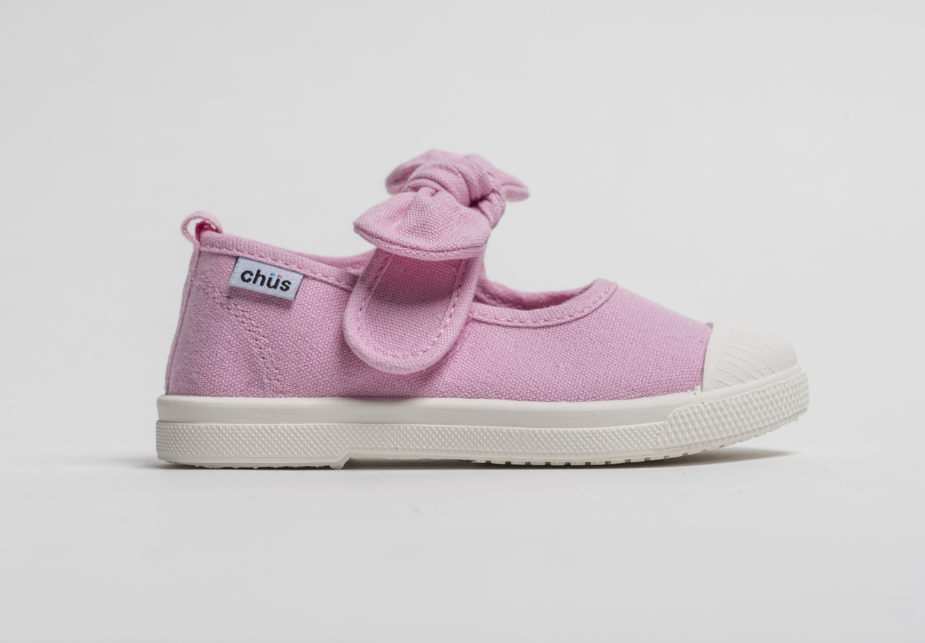 Canvas sneakers with single velcro strap and removable bow tie in light pink. Adorable monogrammed. Chus Shoes. Side view.