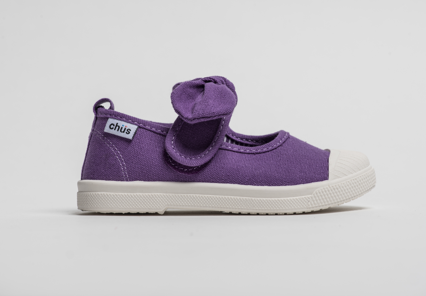 Canvas sneakers with single velcro strap and removable bow tie in purple. Adorable monogrammed. Chus Shoes.