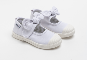 Canvas sneakers with single velcro strap and removable bow tie in white. Adorable monogrammed. Chus Shoes.