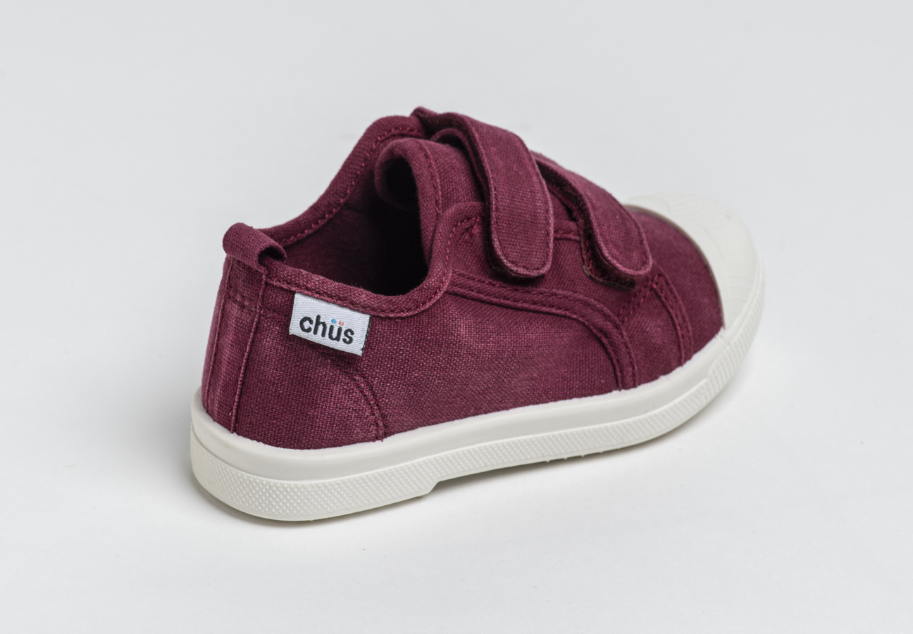 Distressed maroon canvas sneakers with double velcro straps. Chus Shoes. Back view.