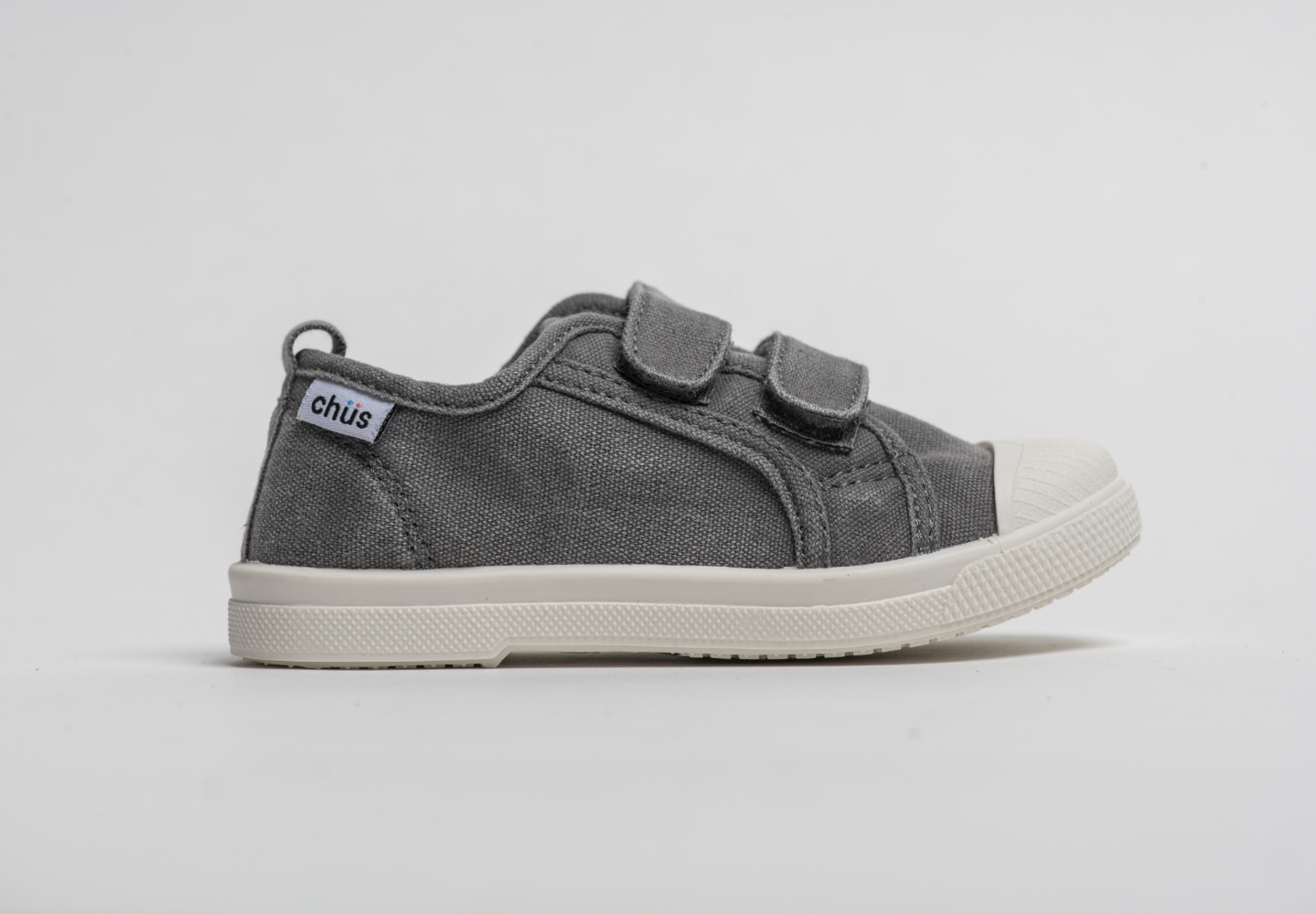 Distressed grey canvas sneakers with double velcro straps. Chus Shoes. Side view.