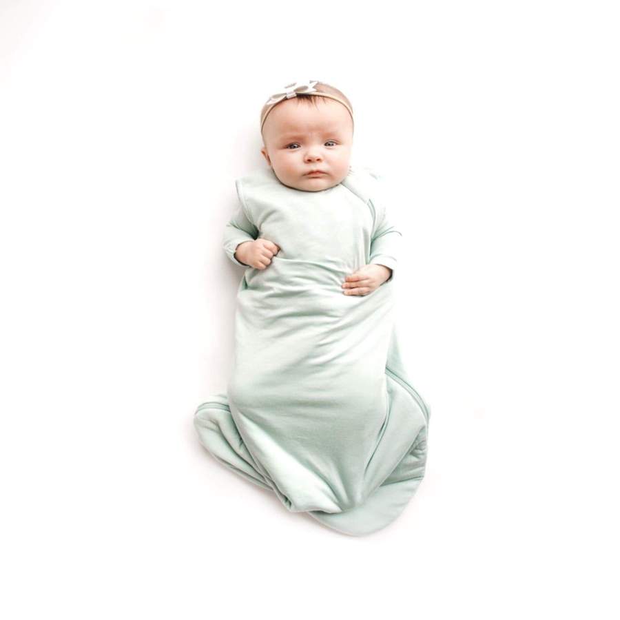 1.0 TOG bamboo super soft infant sleep sack in sage green. From Kyte Baby. Baby girl model
