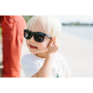 Original navigator baby and toddler sunglasses in "black ops". 100% UVA and UVB protection. Babiators. On model